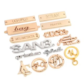 Etiquetas metálicas para bolsos